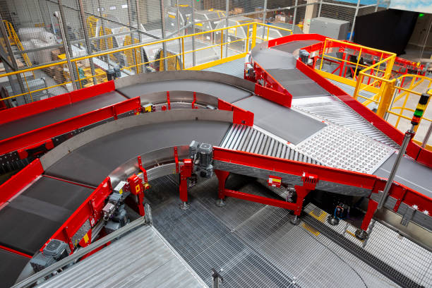 Empty conveyor sorting belt at distribution warehouse. Distribution hub for sorting packages and parcels delivered by air transportation.