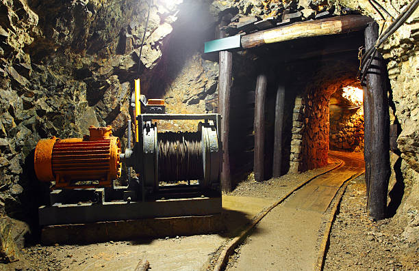Tunnel with carts in gold silver and copper mine