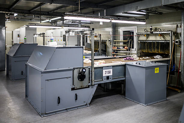 An establishing shot of of in a bustling recycling center.